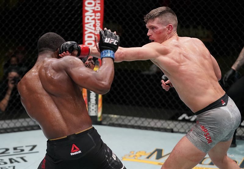 Stephen Thompson punches Geoff Neal in a welterweight fight