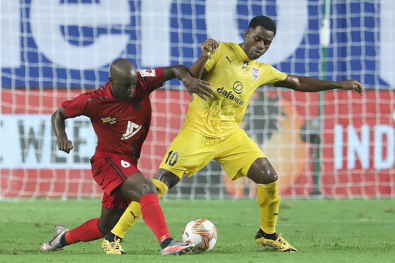 NorthEast United FC&#039;s Khassa Camara (L) battling it out with Bartholomew Ogbeche (Courtesy-ISL)