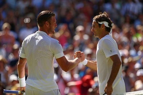 Sam Groth and Roger Federer at Wimbledon in 2015