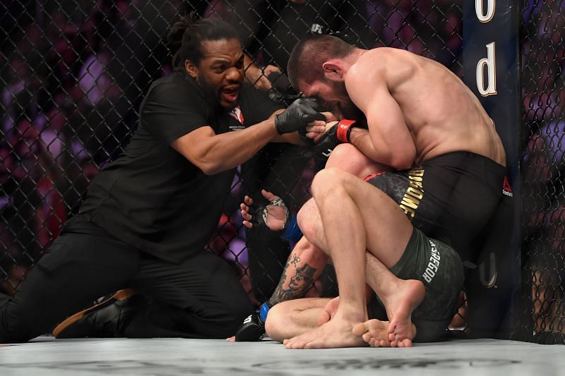 Referee Herb Dean separates Khabib Nurmagomedov of Russia from Conor McGregor