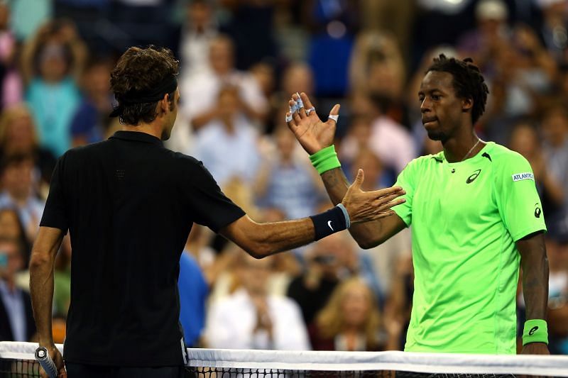 Roger Federer (L) and Gael Monfils