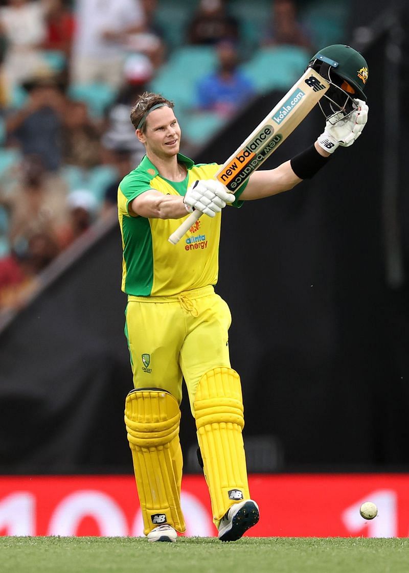 Steve Smith celebrates after scoring a century.