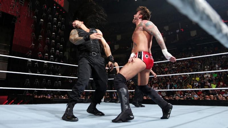 CM Punk and The Shield during their match at TLC 2013