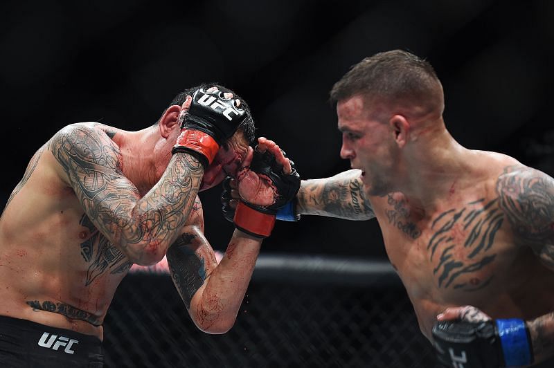 Dustin Poirier punches Max Holloway during the UFC 236 event