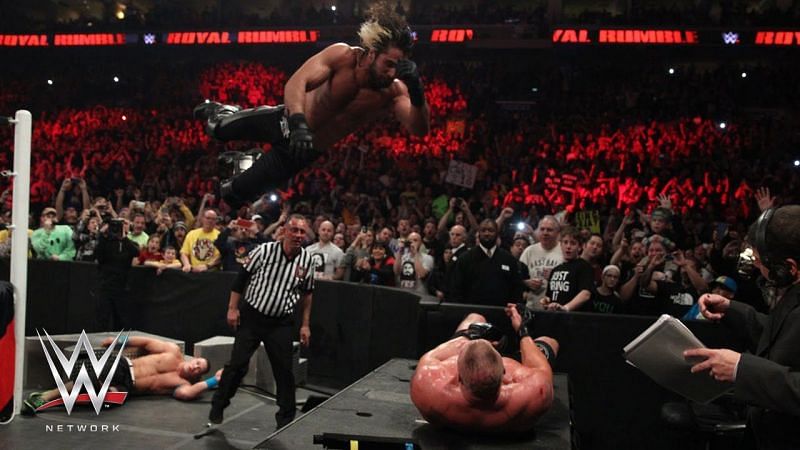 Rollins with a frog splash to Lesnar