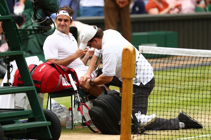 Roger Federer receives treatment at Wimbledon 2016 