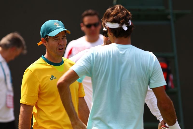 Todd Woodbridge with Roger Federer in 2012