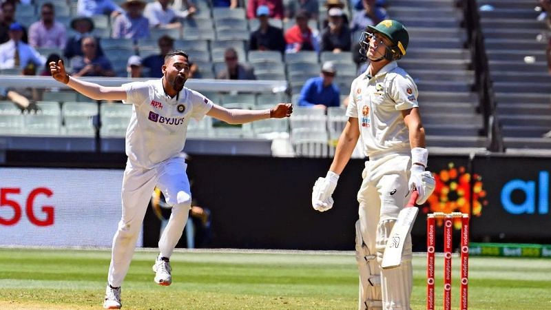 Mohammed Siraj celebrates after dismissing Marnus Labuschagne for his maiden Test wicket.
