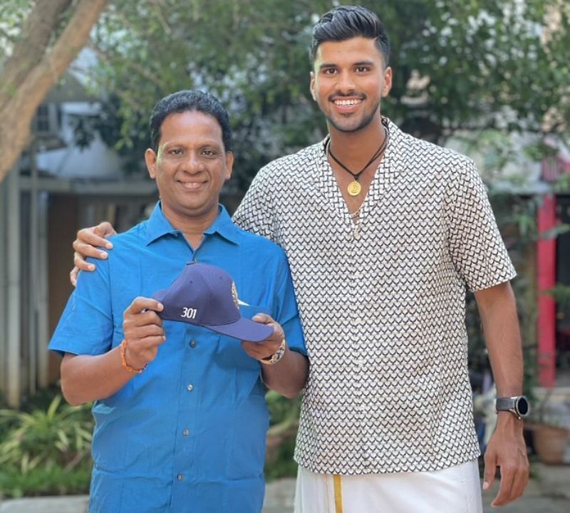 Washington Sundar with his father M Sundar holding his debut Test cap. Pic: Washington Sundar/ Twitter