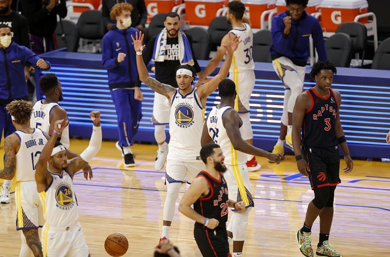 Warriors players celebrate their win over the Toronto Raptors.