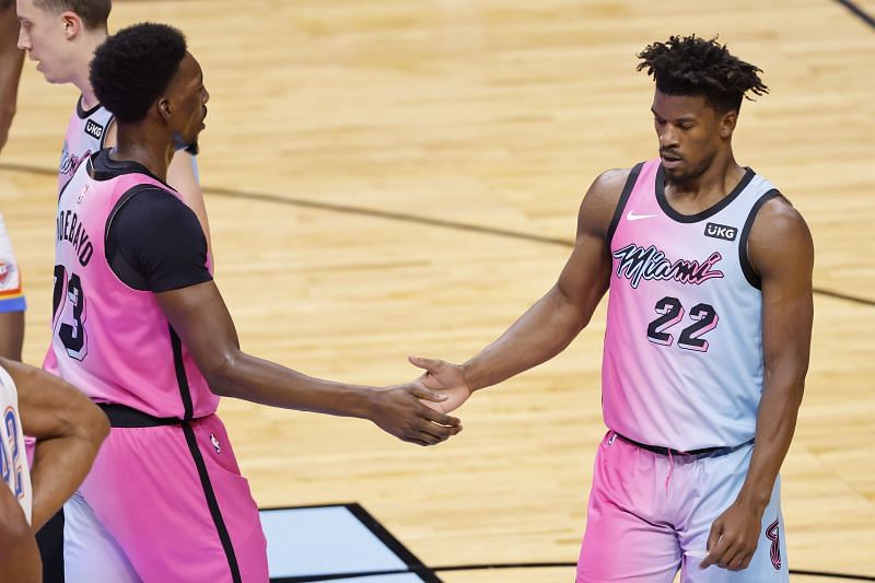 Bam Adebayo and Jimmy Butler of the Miami Heat celebrate a play against the Oklahoma City Thunder during the third quarter at American Airlines Arena