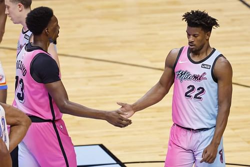 Bam Adebayo and Jimmy Butler of the Miami Heat celebrate a play against the Oklahoma City Thunder during the third quarter at American Airlines Arena