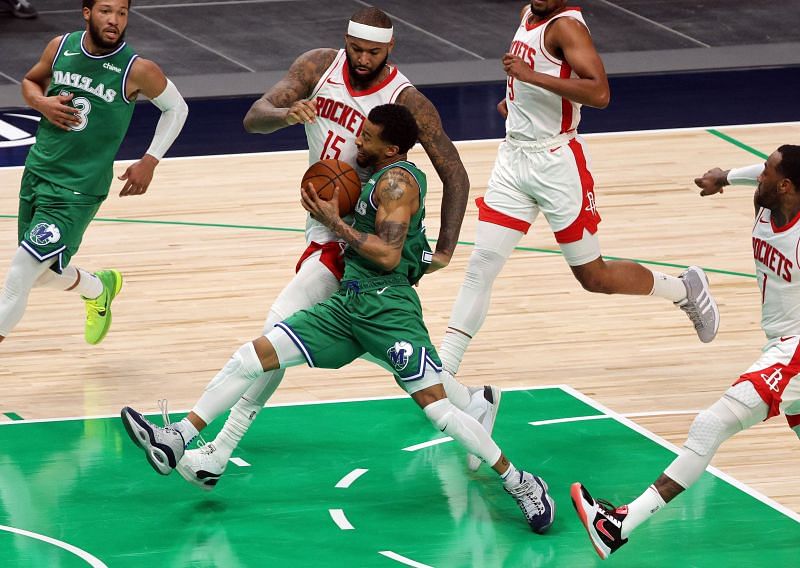 Trey Burke #3 of the Dallas Mavericks controls the ball against DeMarcus Cousins #15 of the Houston Rockets at American Airlines Center on January 23, 2021 (Photo by Ronald Martinez/Getty Images)