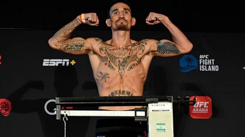 Max Holloway weighs in at 146 lbs.