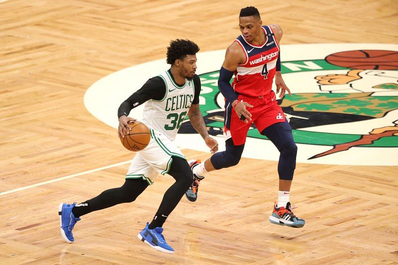 Marcus Smart drives against Russell Westbrook of the Washington Wizards.