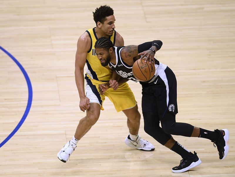 &nbsp;Paul George #3 of the LA Clippers keeps his dribble in front of Malcolm Brogdon #7 of the Indiana Pacers during the first half at Staples Center on January 17, 2021, in Los Angeles, California. (Photo by Harry How/Getty Images)