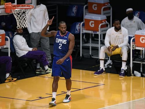 Kawhi Leonard of the LA Clippers signals down court during the season-opening game against the Los Angeles Lakers at Staples Center on December 22, 2020 