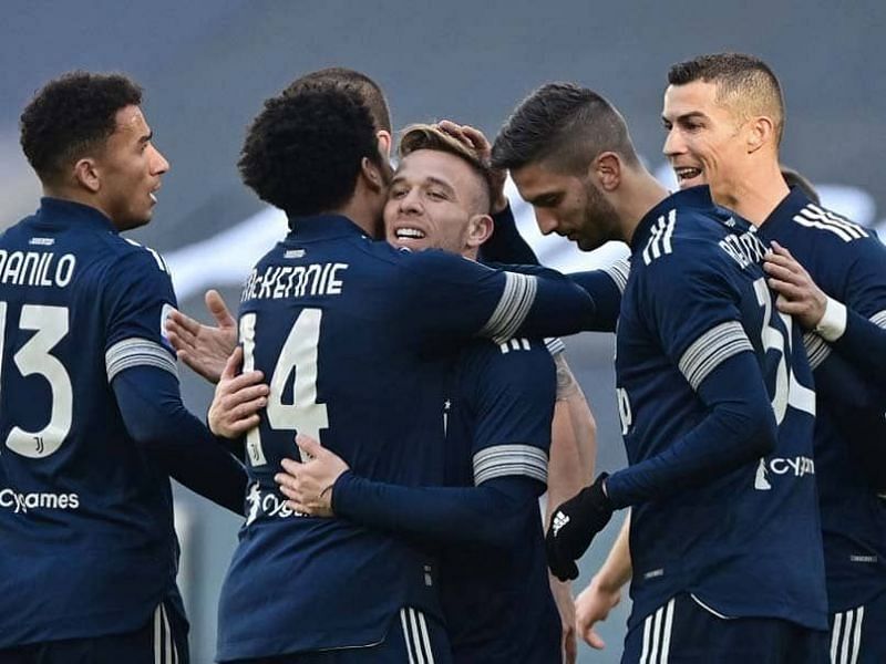 Arthur (center) celebrates with jubilant teammates after scoring his first Juventus goal.