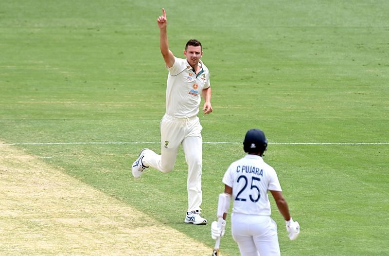 Josh Hazlewood (left) took five wickets in India&#039;s first innings of the ongoing Brisbane Test.