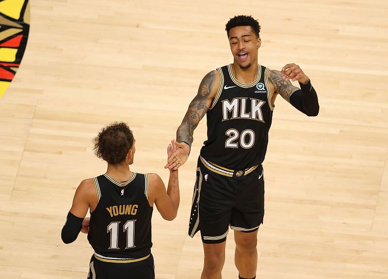 John Collins (#20) and Trae Young (#11) of the Atlanta Hawks