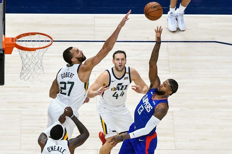 Paul George #13 of the LA Clippers attempts a shot over Rudy Gobert #27 of the Utah Jazz.