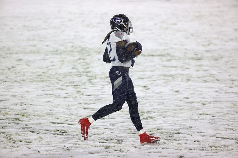 Derrick Henry jogging across a snowy Lambeau field