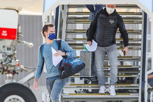 Australian Open players and officia disembarking from a chartered flight in Melbourne