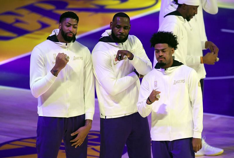 Anthony Davis, LeBron James , and Quinn Cook of the Los Angeles Lakers pose during the 2020 NBA championship ring ceremony&nbsp;