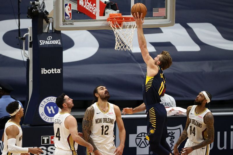 Domantas Sabonis #11 of the Indiana Pacers shoots the ball over Steven Adams #12 of the New Orleans Pelicans.