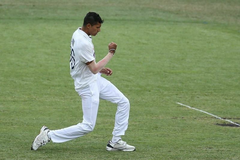 Navdeep Saini celebrates after bagging his maiden Test wicket.