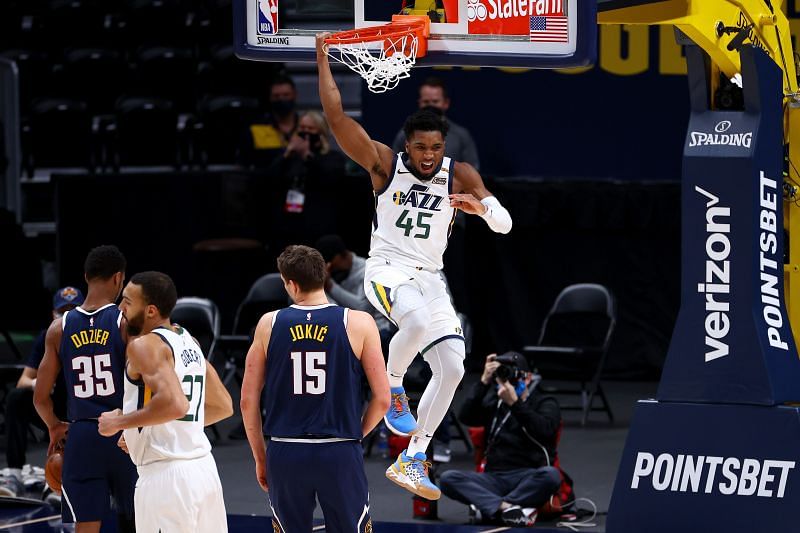 Donovan Mitchell (#45) of the Utah Jazz dunks against the Denver Nuggets.
