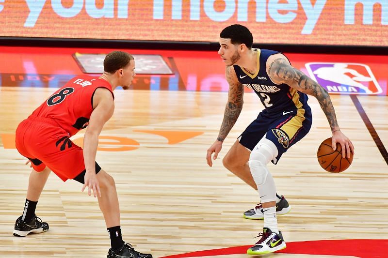 Lonzo Ball #2 of the New Orleans Pelicans dribbles against Malachi Flynn #8 of the Toronto Raptors (Photo by Julio Aguilar/Getty Images)