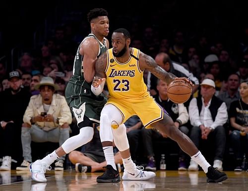 LeBron James #23 of the Los Angeles Lakers backs in on Giannis Antetokounmpo #34 of the Milwaukee Bucks at Staples Center on March 06, 2020 (Photo by Harry How/Getty Images)