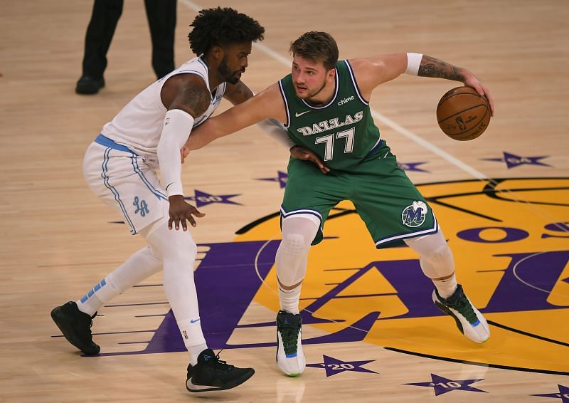 Wesley Matthews of the Los Angeles Lakers guards Luka Doncic of the Dallas Mavericks at Staples Center 