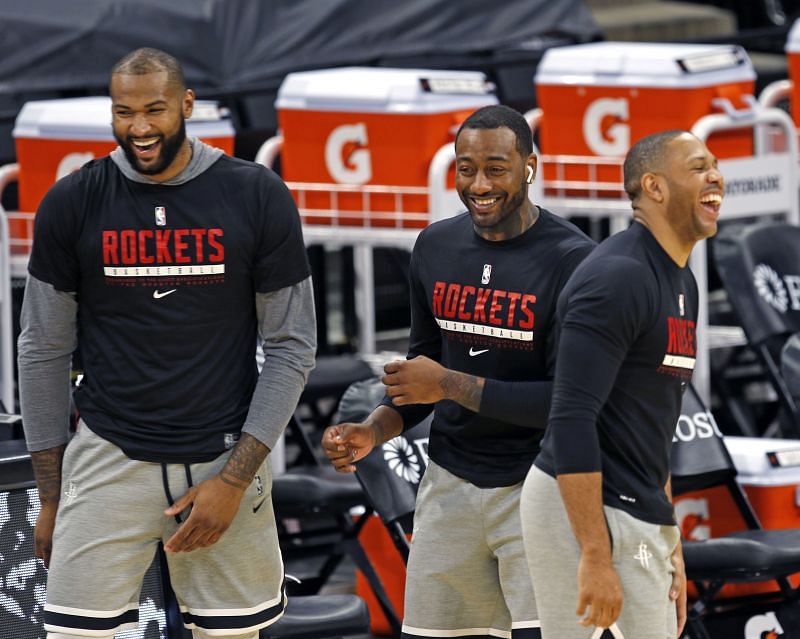 DeMarcus Cousins, John Wall, and Eric Gordon share a light moment before the start of their game against the San Antonio Spurs.