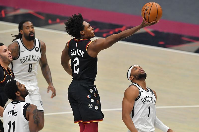 Collin Sexton of the Cleveland Cavaliers shoots over Bruce Brown of the Brooklyn Nets during the first quarter at Rocket Mortgage Fieldhouse