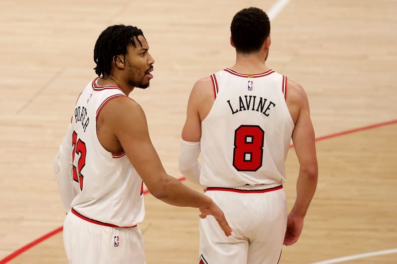 Otto Porter Jr. #22 of the Chicago Bulls celebrates with Zach LaVine #8 after scoring against the Washington Wizards at Capital One Arena on December 31, 2020 (Photo by Rob Carr/Getty Images)