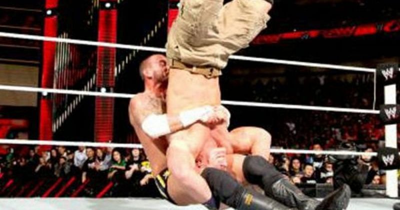 CM Punk hitting the piledriver on John Cena.