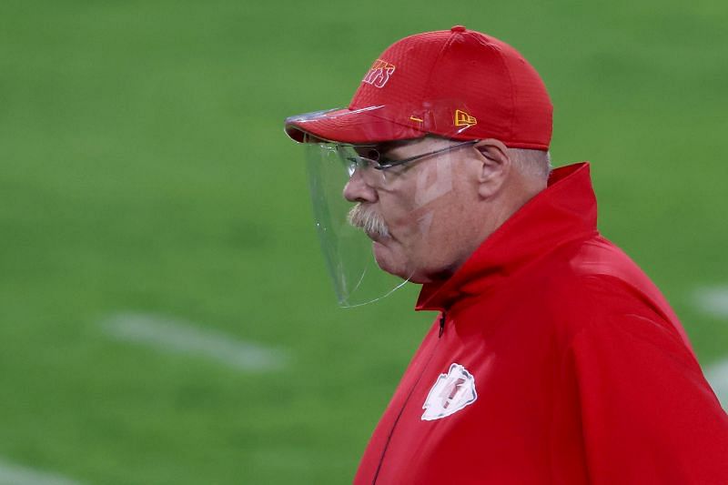 Andy Reid on the sidelines, wearing a face shield
