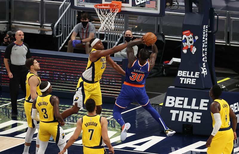 Myles Turner #33 of the Indiana Pacers defends the shot of Julius Randel #30 the New York Knicks.