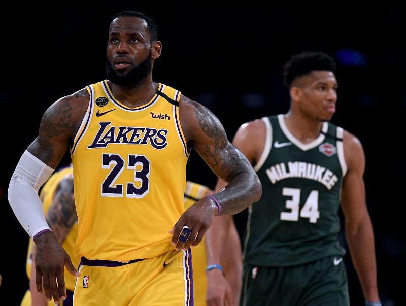 LeBron James of the Los Angeles Lakers reacts after his basket in front of Giannis Antetokounmpo of the Milwaukee Bucks