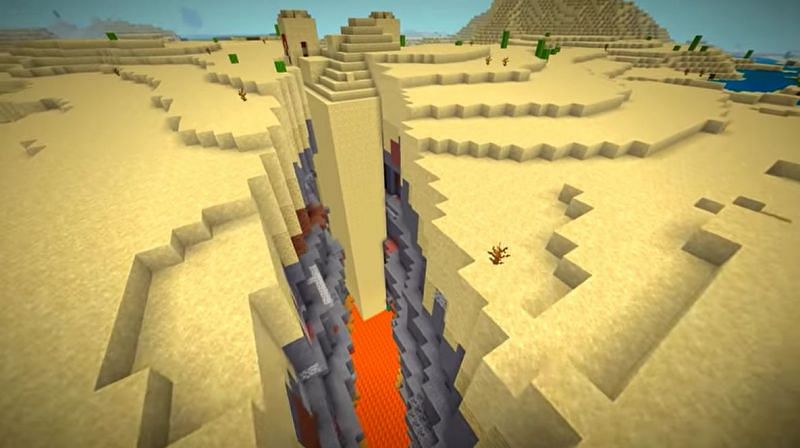 A large desert temple that has partially generated in the middle of ravine (Image via Minecraft &amp; Chill/YouTube)