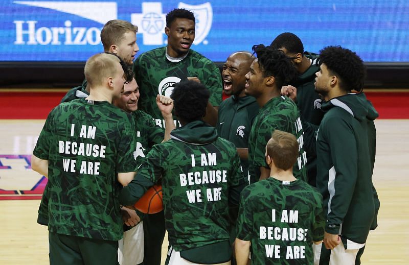 The Michigan State Spartans huddle before an NCAA college basketball