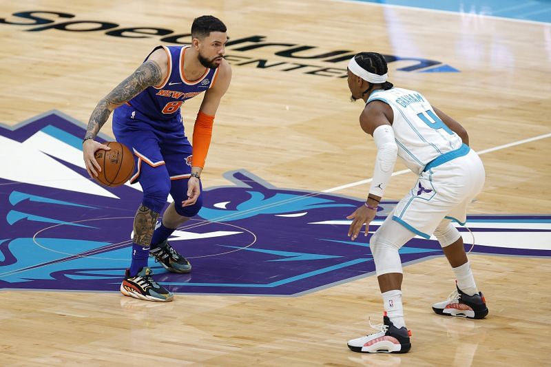 Austin Rivers #8 of the New York Knicks and Devonte&#039; Graham #4 of the Charlotte Hornets during the first quarter of their game at Spectrum Center on January 11, 2021 (Photo by Jared C. Tilton/Getty Images)