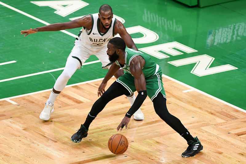 Khris Middleton of the Milwaukee Bucks defends Jaylen Brown of the Boston Celtics during the first half at TD Garden on December 23, 2020 in Boston, Massachusetts.