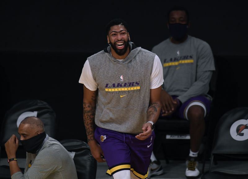 Anthony Davis #3 of the Los Angeles Lakers laughs as he warms up before a preseason game