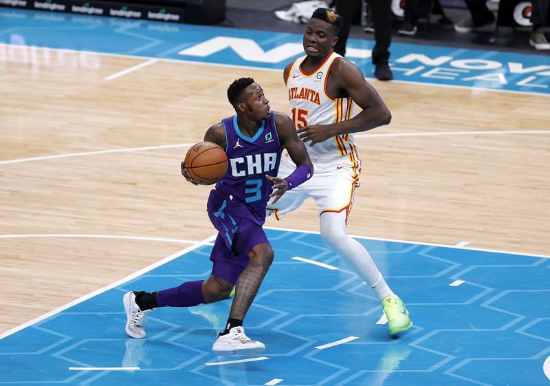 Terry Rozier #3 of the Charlotte Hornets drives to the basket against Clint Capela #15 of the Atlanta Hawks.