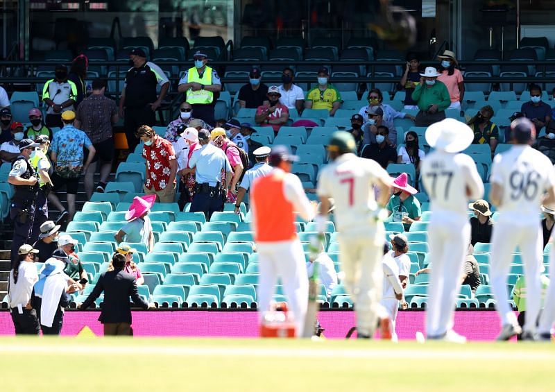 Security officials evict the abusive crowd from SCG on Day Four of the Sydney Test.
