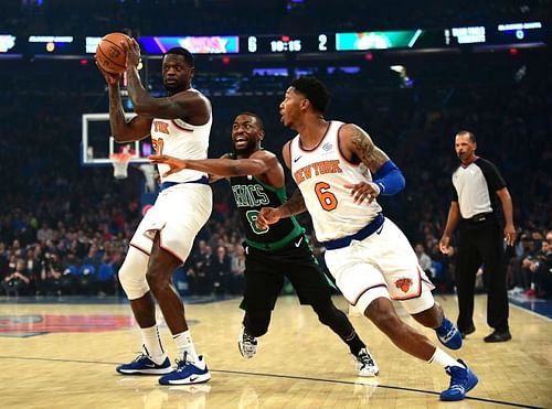 Kemba Walker of the Boston Celtics guards Julius Randle of the New York Knicks 