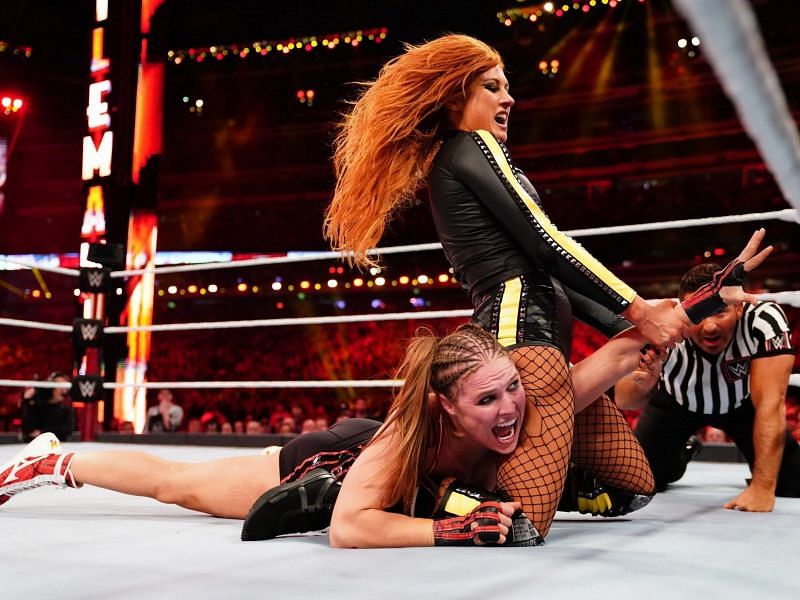 Ronda Rousey and Becky Lynch in action